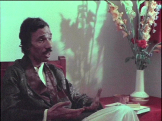 The poet Amal Donqol in a still from Hadeeth al Ghorfa Rakam Thamanya Interview in Room Number Eight Attyat al Abnoudi 1990